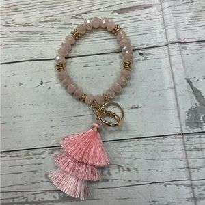 Pink gold beaded keyholder with  pink tassels. Great present